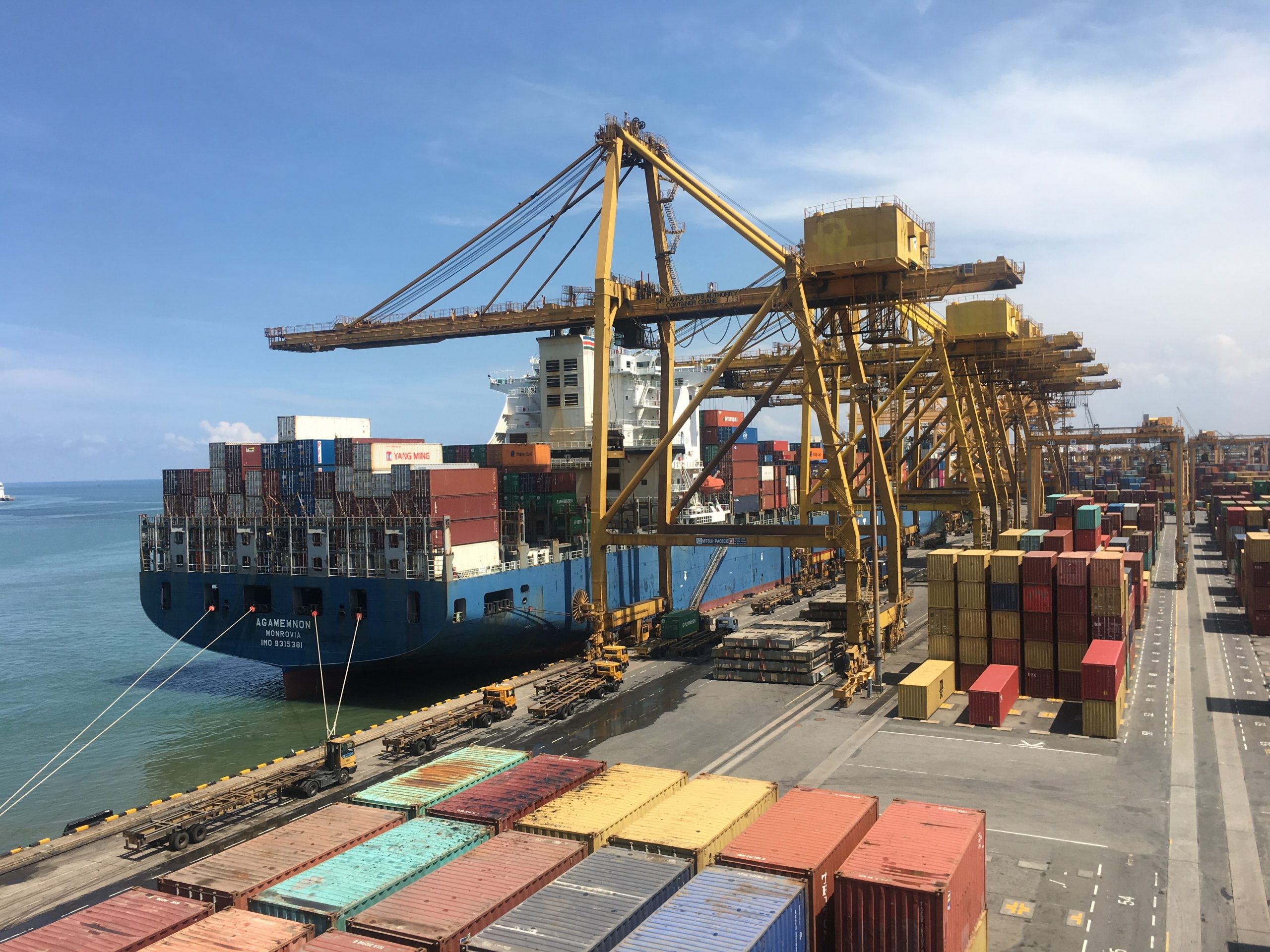 shipping-containers-being-unloaded-at-port
